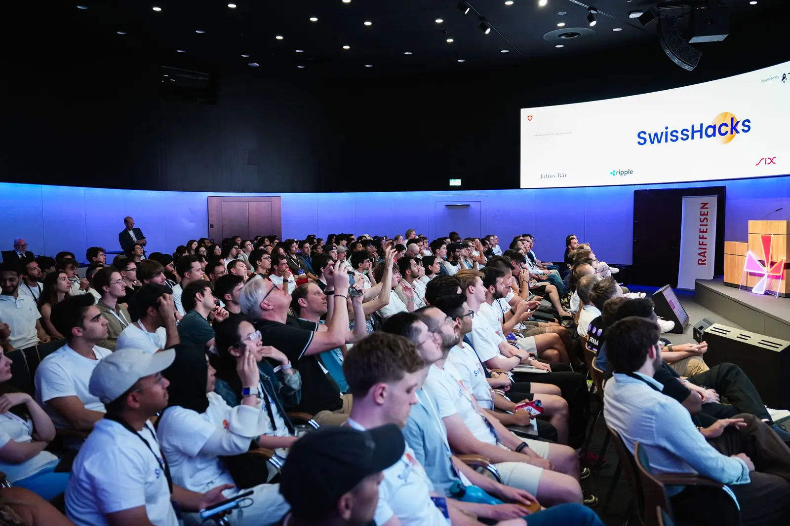 Participants filling the auditorium at SwissHacks 2026 in Zurich.